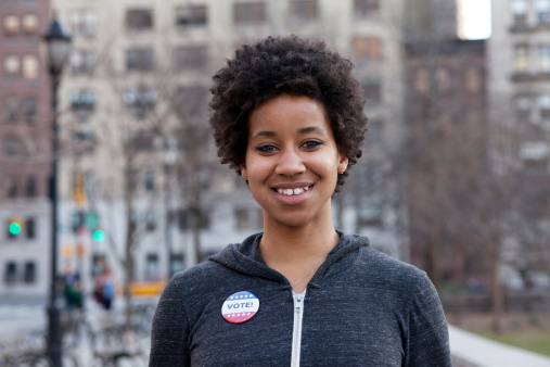 USA, New York, New York City, Portrait of woman with vote pin